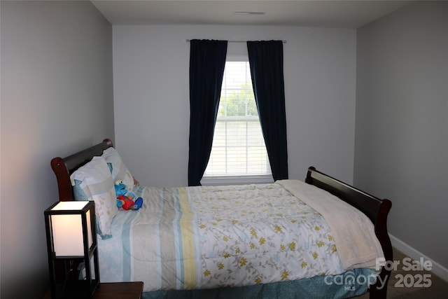 10726 Greenhead View Rd, Charlotte, NC 28262 - carpeted bedroom featuring baseboards
