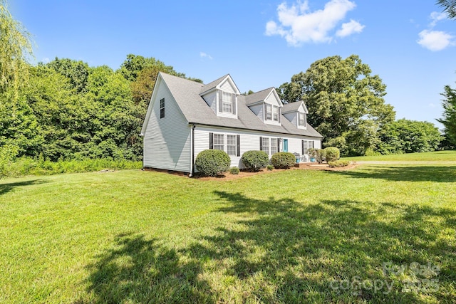 118 Grain Dr, Stony Point, NC 28678 - view of front facade featuring a front yard and roof with shingles