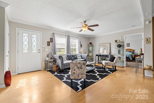 118 Grain Dr, Stony Point, NC 28678 - living area featuring wood finished floors, ceiling fan, ornamental molding, and a textured ceiling