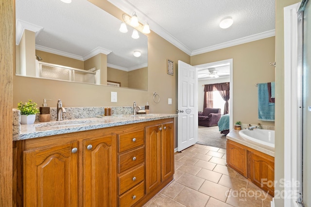 118 Grain Dr, Stony Point, NC 28678 - bathroom featuring double vanity, a textured ceiling, tile patterned flooring, a stall shower, and crown molding