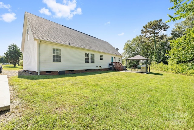 118 Grain Dr, Stony Point, NC 28678 - back of property featuring a gazebo, crawl space, a lawn, a shingled roof, and a patio area