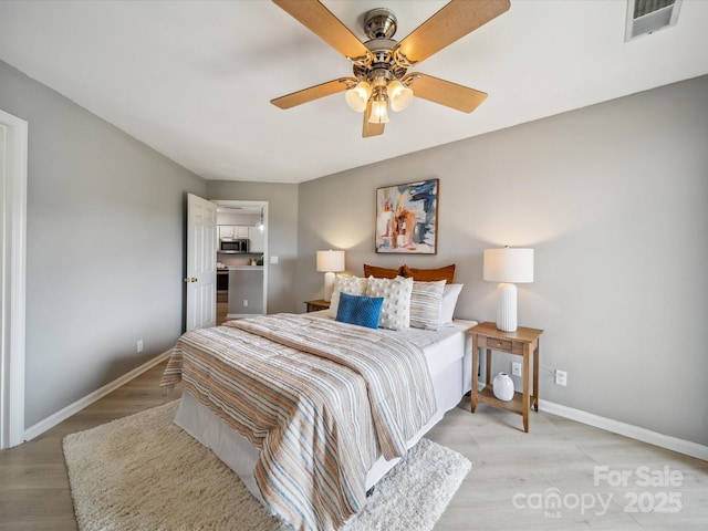 18817 Nautical Dr Unit 302, Cornelius, NC 28031 - bedroom featuring light wood-style flooring and a ceiling fan