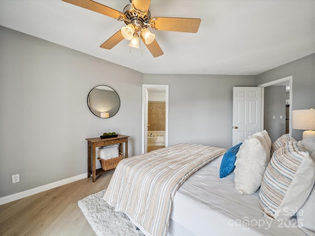 18817 Nautical Dr Unit 302, Cornelius, NC 28031 - bedroom with light wood-type flooring, a ceiling fan, and ensuite bathroom