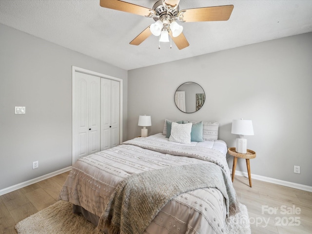 18817 Nautical Dr Unit 302, Cornelius, NC 28031 - bedroom featuring wood finished floors, a closet, and ceiling fan