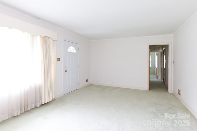 205 Hillcrest Ave, Rock Hill, SC 29732 - foyer entrance featuring light colored carpet, crown molding, and baseboards