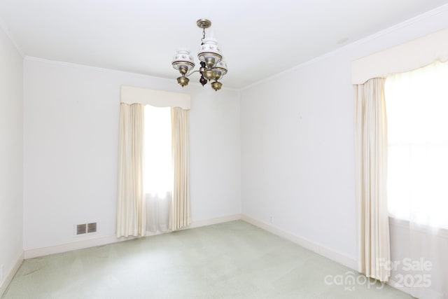 205 Hillcrest Ave, Rock Hill, SC 29732 - carpeted spare room with a chandelier, crown molding, and baseboards
