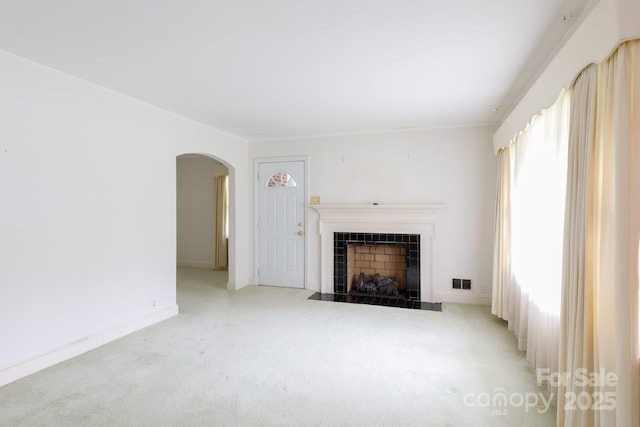 205 Hillcrest Ave, Rock Hill, SC 29732 - unfurnished living room featuring arched walkways, a fireplace, carpet, and baseboards