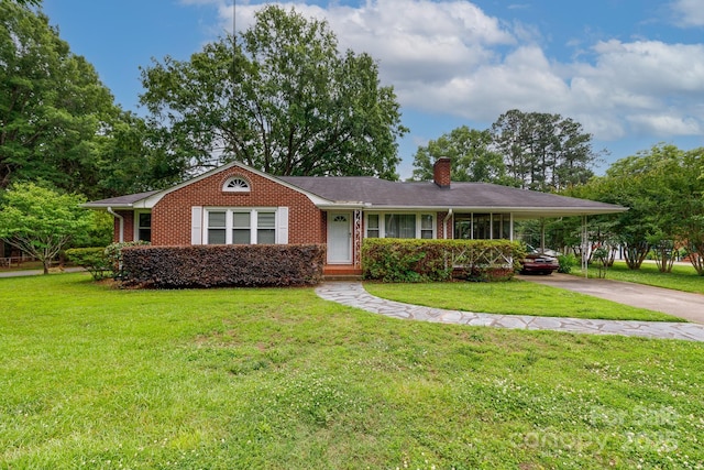 205 Hillcrest Ave, Rock Hill, SC 29732 - view of front of house with a chimney, concrete driveway, a front yard, brick siding, and a carport