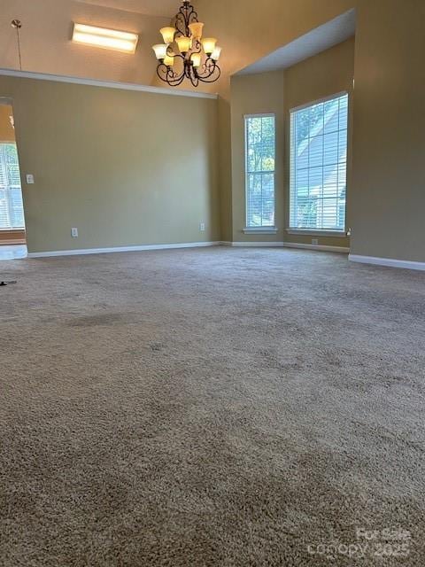 8901 Clifton Meadow Dr, Matthews, NC 28105 - carpeted empty room with a chandelier and baseboards
