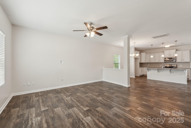 3107 Riker St, Clover, SC 29710 - unfurnished living room with ceiling fan, dark wood-style flooring, and baseboards