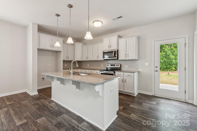 3107 Riker St, Clover, SC 29710 - kitchen featuring stainless steel appliances, a sink, dark wood-style floors, and baseboards