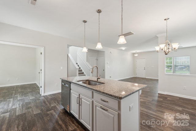 3107 Riker St, Clover, SC 29710 - kitchen featuring stainless steel dishwasher, a sink, dark wood-style floors, an island with sink, and decorative light fixtures