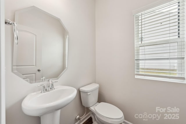 3107 Riker St, Clover, SC 29710 - half bath with toilet, healthy amount of natural light, a sink, and baseboards