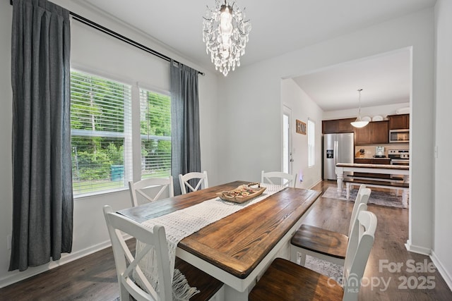3951 Tersk Dr, Midland, NC 28107 - dining area with baseboards, dark wood finished floors, and a chandelier