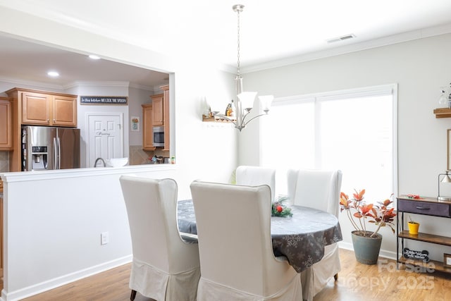 16142 Commodore Dr, Lancaster, SC 29720 - dining space featuring a chandelier, ornamental molding, light wood-style floors, and recessed lighting