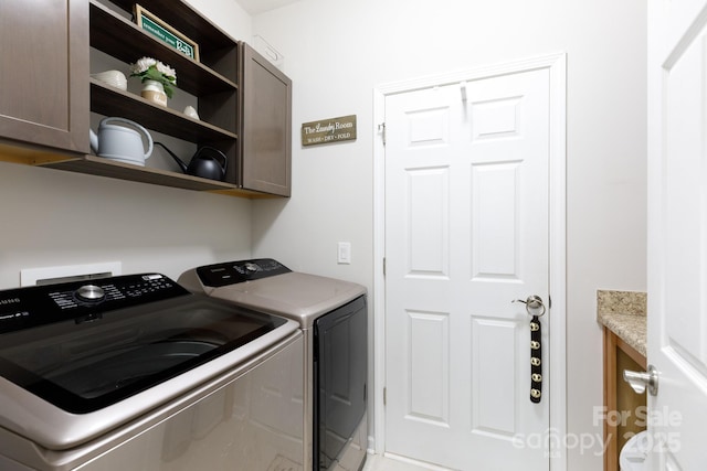 16142 Commodore Dr, Lancaster, SC 29720 - washroom with cabinet space and washing machine and clothes dryer