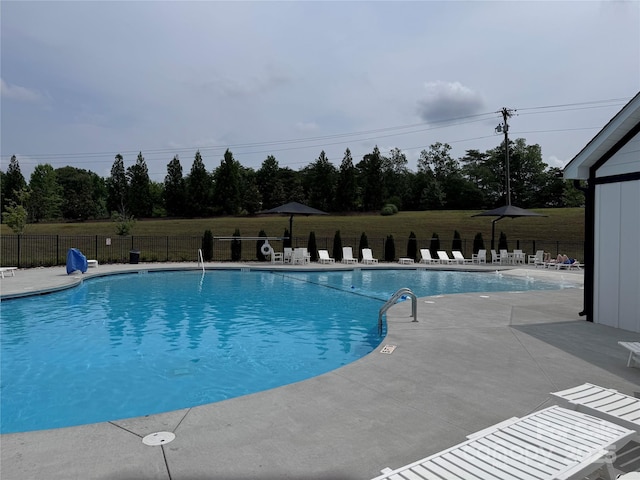 16142 Commodore Dr, Lancaster, SC 29720 - community pool featuring a patio area and view of wooded area