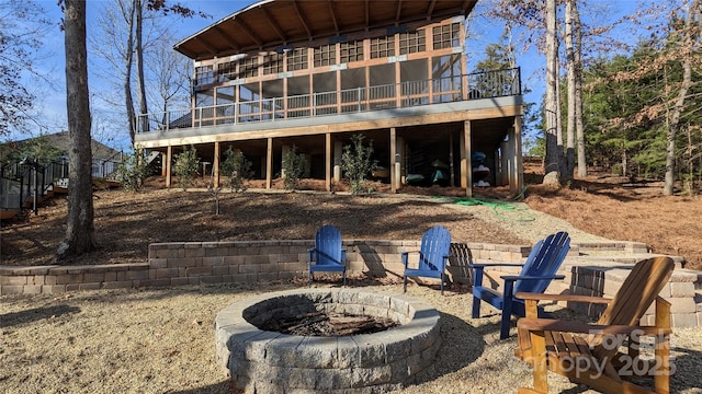 16142 Commodore Dr, Lancaster, SC 29720 - back of house featuring a fire pit and a deck