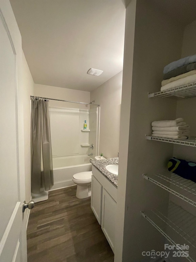 323 J C Dellinger Rd, Cherryville, NC 28021 - bathroom with wood finished floors, shower / bathtub combination with curtain, toilet, and vanity