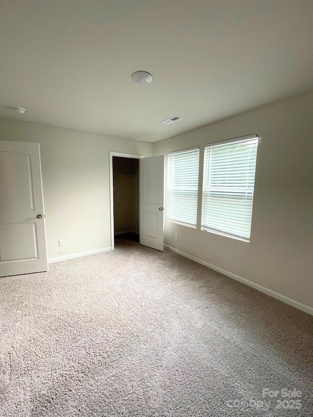 323 J C Dellinger Rd, Cherryville, NC 28021 - unfurnished bedroom with baseboards, carpet, and a closet