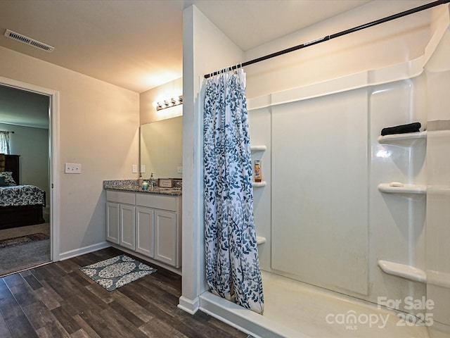 323 J C Dellinger Rd, Cherryville, NC 28021 - ensuite bathroom featuring wood finished floors, curtained shower, and vanity