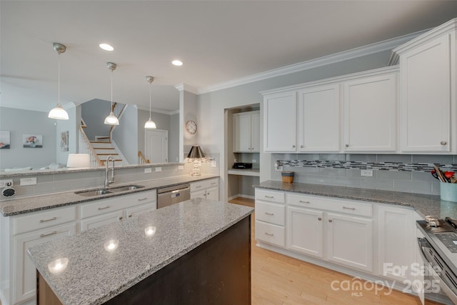 14727 Brannock Hills Dr, Charlotte, NC 28278 - kitchen with stainless steel appliances, a sink, a center island, white cabinets, and decorative backsplash