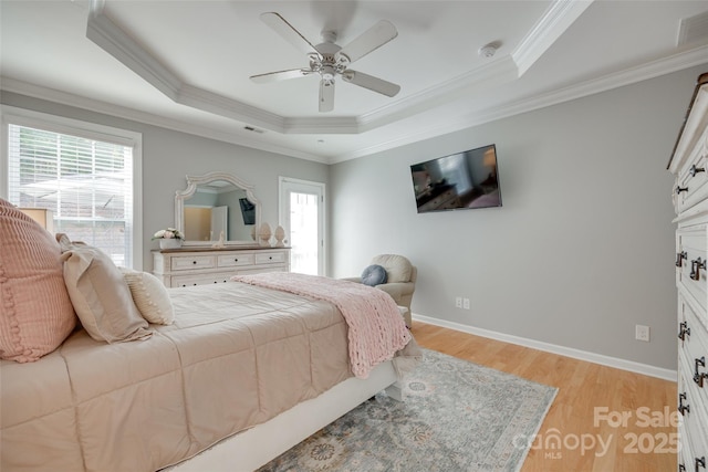 14727 Brannock Hills Dr, Charlotte, NC 28278 - bedroom with a tray ceiling, multiple windows, light wood finished floors, crown molding, and baseboards