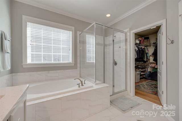 14727 Brannock Hills Dr, Charlotte, NC 28278 - bathroom with crown molding, a garden tub, a shower stall, healthy amount of natural light, and a walk in closet