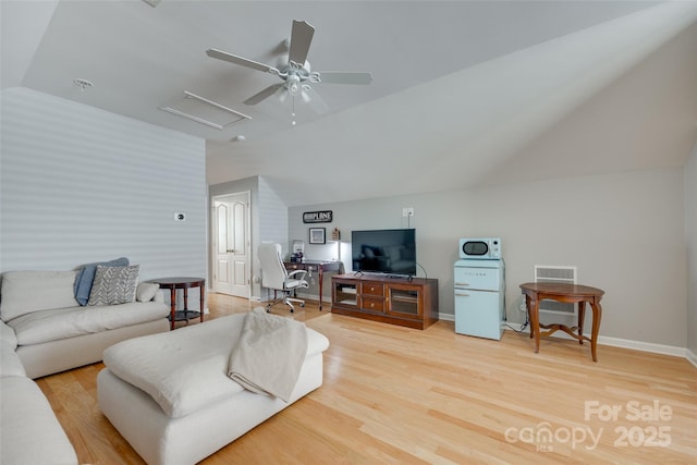14727 Brannock Hills Dr, Charlotte, NC 28278 - living room with vaulted ceiling, light wood-type flooring, attic access, a ceiling fan, and baseboards