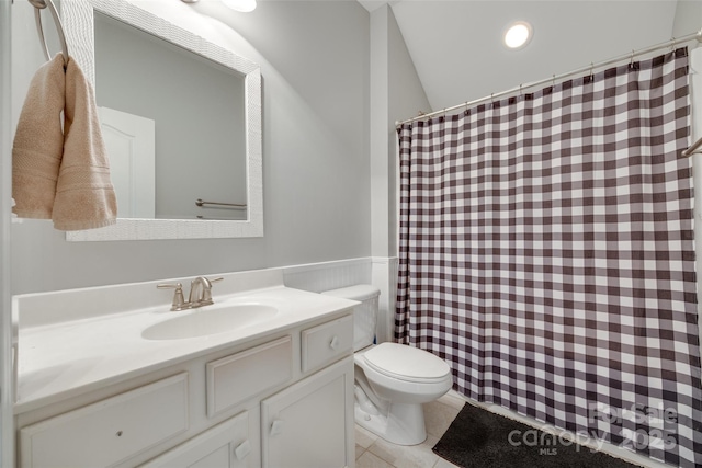 14727 Brannock Hills Dr, Charlotte, NC 28278 - full bath with toilet, vanity, a wainscoted wall, a shower with shower curtain, and tile patterned floors