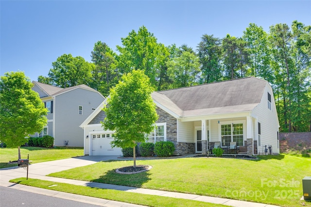 14727 Brannock Hills Dr, Charlotte, NC 28278 - view of front of property featuring driveway, stone siding, an attached garage, and a front lawn