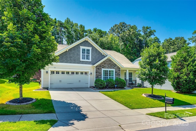 14727 Brannock Hills Dr, Charlotte, NC 28278 - view of front of home with driveway, a front lawn, stone siding, and an attached garage