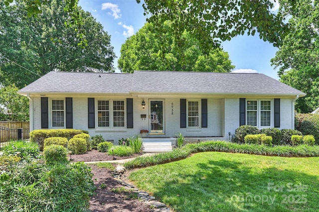 6938 Wrentree Dr, Charlotte, NC 28210 - ranch-style home featuring brick siding, a shingled roof, and a porch