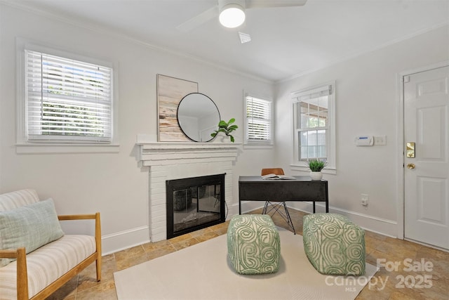 6938 Wrentree Dr, Charlotte, NC 28210 - sitting room with crown molding, ceiling fan, a brick fireplace, baseboards, and a desk
