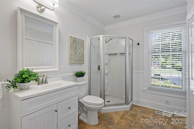6938 Wrentree Dr, Charlotte, NC 28210 - bathroom with vanity, a shower stall, plenty of natural light, ornamental molding, and wainscoting