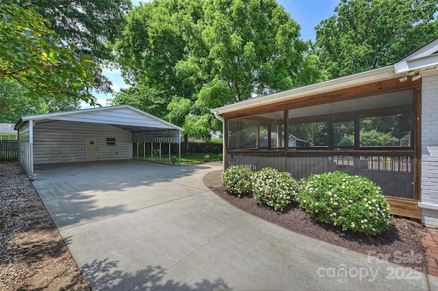 6938 Wrentree Dr, Charlotte, NC 28210 - view of parking featuring driveway and a carport