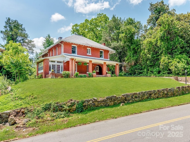 128 W End St, Chester, SC 29706 - traditional style home with a chimney, brick siding, a porch, and a front lawn