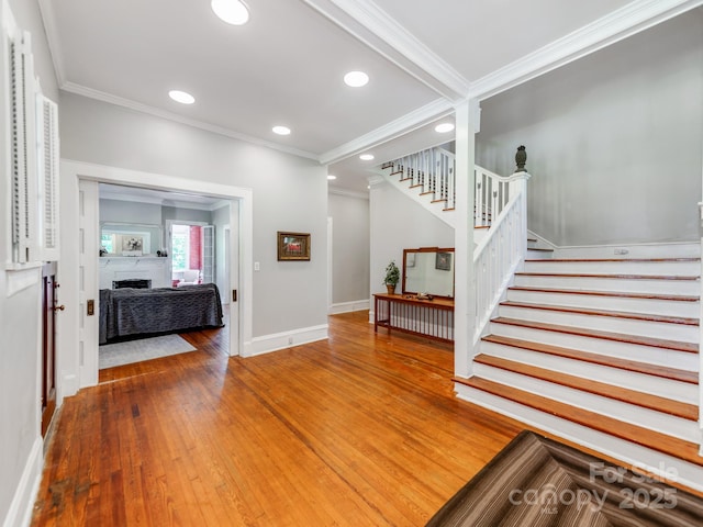 128 W End St, Chester, SC 29706 - stairs with ornamental molding, baseboards, a fireplace, wood-type flooring, and recessed lighting