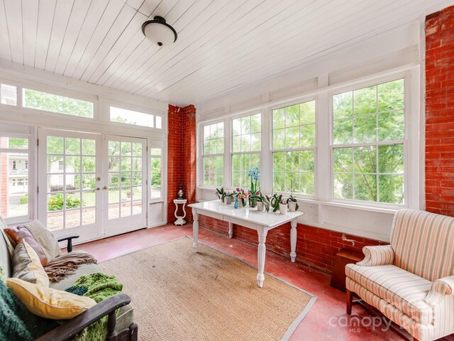 128 W End St, Chester, SC 29706 - sunroom / solarium featuring french doors, brick wall, concrete floors, and wooden ceiling