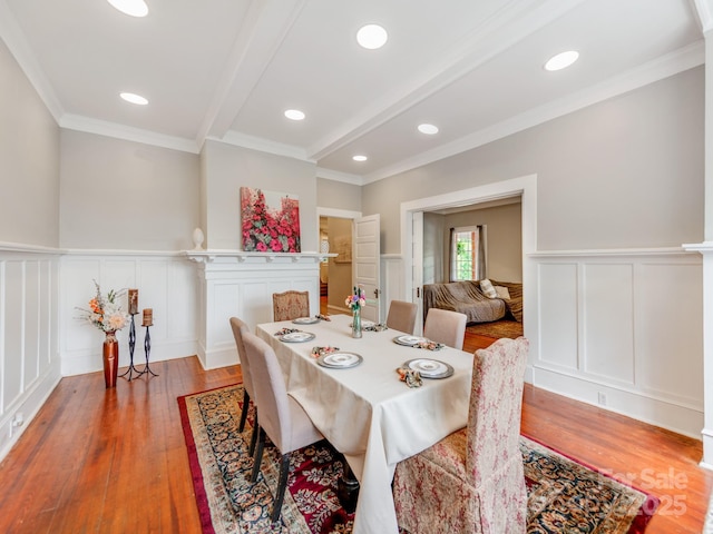 128 W End St, Chester, SC 29706 - dining space with a decorative wall, crown molding, light wood finished floors, beam ceiling, and wainscoting