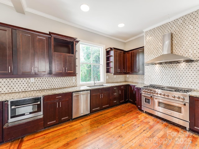 128 W End St, Chester, SC 29706 - kitchen featuring appliances with stainless steel finishes, wall chimney range hood, a sink, open shelves, and dark brown cabinets