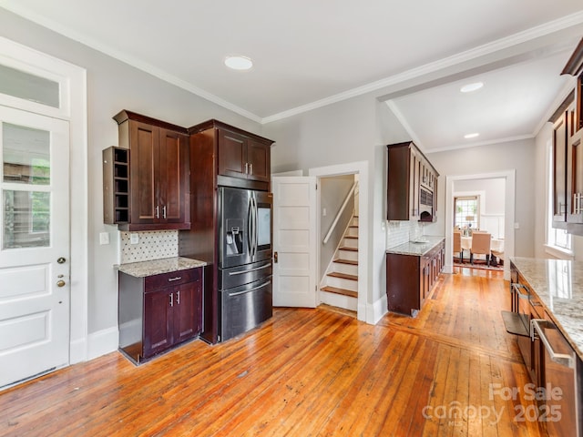 128 W End St, Chester, SC 29706 - kitchen featuring stainless steel appliances, light wood-style flooring, tasteful backsplash, light stone counters, and recessed lighting