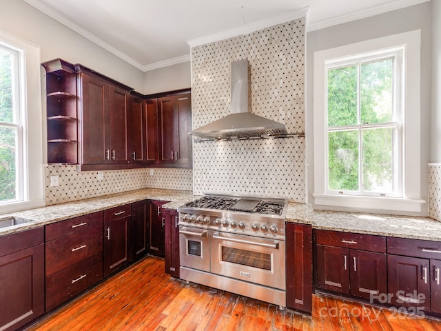 128 W End St, Chester, SC 29706 - kitchen with double oven range, wall chimney exhaust hood, plenty of natural light, and ornamental molding