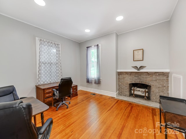128 W End St, Chester, SC 29706 - office area with light wood-style flooring, ornamental molding, baseboards, recessed lighting, and a fireplace