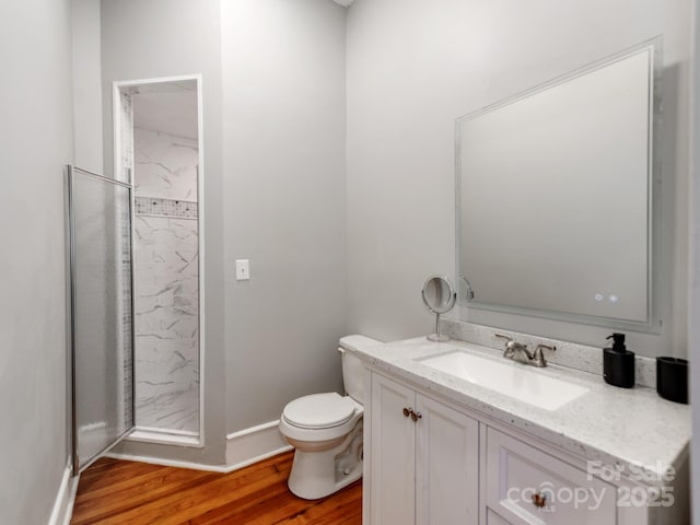 128 W End St, Chester, SC 29706 - bathroom with wood finished floors, toilet, and vanity