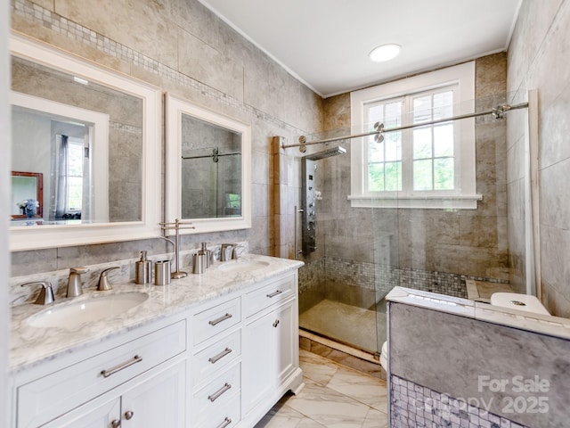 128 W End St, Chester, SC 29706 - bathroom with a stall shower, double vanity, marble finish flooring, and crown molding