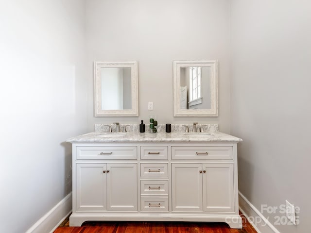 128 W End St, Chester, SC 29706 - full bathroom with double vanity, baseboards, and wood finished floors