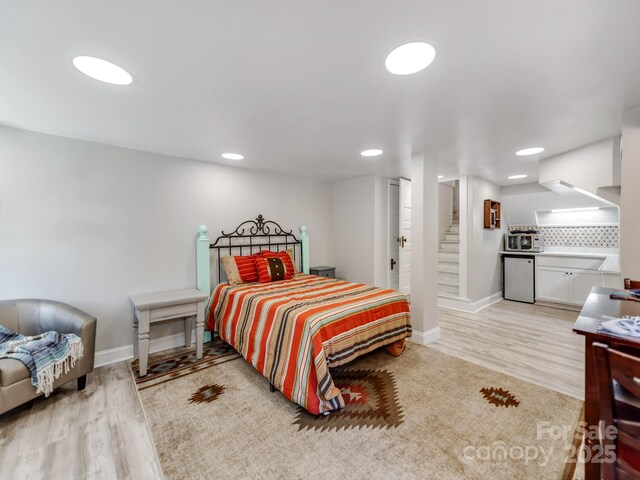 128 W End St, Chester, SC 29706 - bedroom featuring baseboards, light wood-style flooring, recessed lighting, and connected bathroom