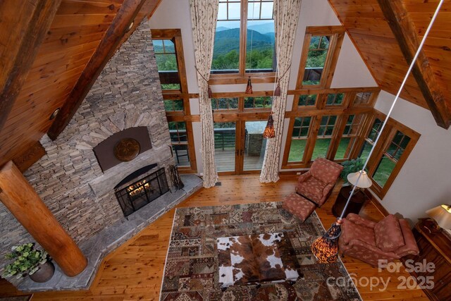 610 Rocky Pkwy Unit 52, 47A, Banner Elk, NC 28604 - living room featuring wood-type flooring, a fireplace, high vaulted ceiling, a mountain view, and wood ceiling with exposed beams