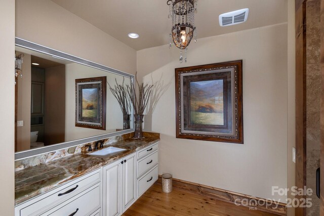 610 Rocky Pkwy Unit 52, 47A, Banner Elk, NC 28604 - bathroom featuring vanity, toilet, wood finished floors, and baseboards
